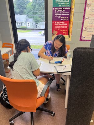One of our tutors teaching a student Mandarin.
